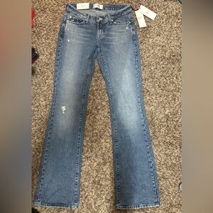 7 FOR ALL MANKIND Low-rise bootcut jeans.